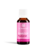 Brown glass bottle with white cap and pink label reading Dr Niedermayer Beauty Drink Hyaluron on a white background