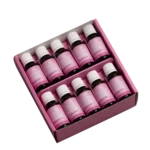 Hyaluron_20x20ml_Boxpng | Performance Nutrition Schweiz 20 small brown bottles with white caps in a pink display box labeled Hyaluron for skincare serums